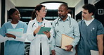 Tablet, walking and medical team at clinic for discussion, planning schedule or insurance documents. Hospital, people or doctors with tech for healthcare report, advice or help with nurses in hallway