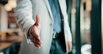 Person, restaurant and POV handshake for agreement, partnership or investment deal. Welcome, introduction or entrepreneur shaking hands for investor, stakeholder or business owner meeting in cafe