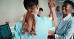 High five, boardroom and business women in meeting for finance review, planning or funding proposal. Laptop, corporate and people with success for financial analysis, profit growth and investment