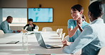 Finance, high five and laptop with business women in boardroom for review of data charts. Computer, conversation and investment success with employee people in financial workplace for risk management