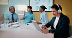 Finance, headphones and laptop with man in boardroom for review of data charts or statistics. Graphs, streaming and typing with broker in meeting at financial workplace for investment planning