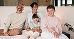 Face, family and children relax on bed for bonding, holiday and happiness in home. Smile, comfort and mother with father laughing and tickle kid for weekend fun, connection and playful in portrait