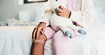 Plaster, kid or hands in home with toy, first aid or sore leg with wound protection. Health, injury bandage or girl in house with teddy bear, pain discomfort or recovery care in child development.