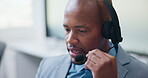 Agent, man or consulting with headset in call center for client support, loan advice or chat. Coworking, finance consultant or talking at helpdesk for insurance claim, online help or customer service