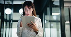 Businesswoman, walking and thinking with tablet in office, scroll or plan for investment opportunity. Wealth manager, smile and mature person with tech for risk management, bokeh and browsing info