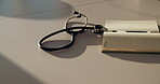 Medical, notebook and stethoscope on desk in hospital for heartbeat monitor, schedule reminder or wellness. Healthcare report, cardiology and research with doctors equipment in clinic or empty office