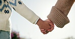 Person, park and holding hands with kid for bonding, support and adventure outdoor. Family, sunshine and parent with love for child with relationship, development and trust in nature together