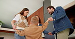 Happy, parents and dancing with children in home for bonding, weekend fun and healthy relationship. Low angle, people and kids holding hands in circle with movement, music rhythm or family connection