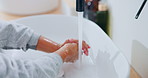 Kid, hands and washing with water for hygiene, disinfection or cleanliness in bathroom sink or home. Child, cleaning and rinse with soap or scrub in basin for dirt, bacteria or germ removal in house