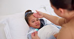 Sick, girl and mom with thermometer in bed for fever, influenza or temperature in home. Child, kid and mother monitoring cold with cough, allergy or flu symptoms for virus or infection in house