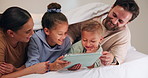 Happy, tablet and parents with children on bed for watching movies, online videos and bonding. Family, home and kids with mom, dad and tech for connection, internet and relax together on weekend