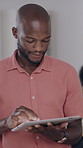 Business, black man and reading with tablet in office for research, proofreading and newsletter. Male person, digital and review email for editor feedback, copywriting report and publication schedule