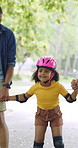 Rollerskate, parents and holding hands with child in park for outdoor fun, learning and support. Happy, family or people bonding with kid for practice, teaching and hobby together on weekend