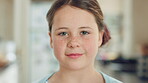 Face, child and girl with smile in kitchen at home, weekend break and positive attitude for wellness. Portrait, chill and kid with happiness in apartment, good mood or relax for childhood development
