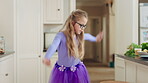 Energy, dance and child with ballet in kitchen for performance practice, costume and growth. Girl kid, ballerina spin or routine with tutu in home for learning steps, physical development or rhythm