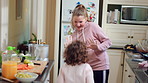 Happy, children and high five in home with dancing, sisters bonding together and music for connection. Girl, siblings play and holding hands in kitchen with spin, fun energy and rhythm for song.