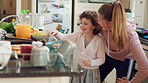 Happy, children and eating sweets with dancing, sisters bonding together and family connection in home. Girl, siblings play and chocolate candy in kitchen with trust, fun energy and rhythm for song.