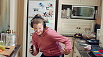 Headphones, excited and child dance in kitchen with energy, streaming service and music playlist. Girl, audio and moving at home with phone for sound, freedom and listening to radio song on weekend