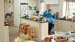 Dancing, headphones and man in kitchen with energy for performance, audio or playlist in home. Tech, movement and person with down syndrome for hobby, entertainment and weekend fun in apartment