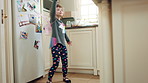 Costume, dancing and child with smile in kitchen, creative expression and playing for development. Childhood, spoon and girl with fantasy dress up for imagination growth, home and moving to music