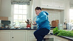 Kitchen, dance and teen with spoon, jump and performance for cooking success and moving with energy. Dancer, active and person with down syndrome, juggle and celebration for culinary skills in house