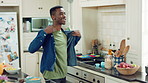 Music, cooking and black man with dance in kitchen for lunch, meal prep and ingredients. Home, happy and person with audio, playlist and song for groove, rhythm and movement with recipe on weekend