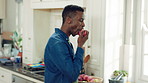 Hungry, man and apple in kitchen with healthy snack, antioxidants and vitamins for wellness benefits. Black person, eating organic fruit and fresh produce in home for fiber, vegan diet and nutrition.