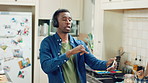 Kitchen, black man and dance with headphones, freedom and celebration with sound in apartment. Happy person, moving and music with rhythm at home, streaming audio or listen to radio with phone