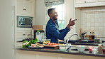 Home, black man and dancing for freedom, energy and weekend celebration with audio in apartment. Happy person, moving and music with rhythm at kitchen, unwind and pointing with good mood in morning