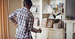 Black man, dancing and fun with headphone at house with energy, playful rhythm and streaming audio. Male person, dancer and listening to music with movement, choreography and hiphop for weekend break