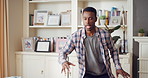 Dancing, music and black man in home with energy, rhythm or movement to playlist on weekend. Happy, groove and African male person listening to album with choreography in living room at house.