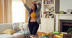 Singing, dance and woman in home with music for good mood, positive energy and karaoke. Happy, living room and person with headphones for streaming radio, audio and playlist for groove on weekend