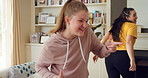 Mother, child and singing in living room with dance, music or bonding together for family connection. Happy, mom and daughter in home lounge with fun relationship, weekend break or movement for song.