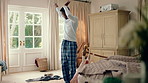 Dancing, laundry and black man in home with energy for celebration, performance or practice. Happy, movement and male person with expression for hobby, entertainment and morning chore fun in pyjamas
