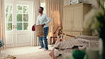 Dancing, chores and black man in home with energy for celebration, performance or practice. Happy, movement and male person with expression for hobby, entertainment and morning laundry fun in pyjamas