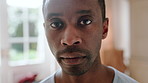 Calm, serious and face of man in home with peaceful morning, weekend break or solitude on day off. Chill, black person or quiet afternoon in living room for me time, passive emotion or relax in house