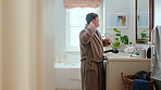 Teenager, singing and fun with toothbrush in bathroom with energy, morning karaoke and dental hygiene. Boy, singer or haircare with vocal talent, musical concert and person with down syndrome in home