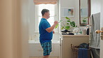 Man, dancing and fun with rhythm in bathroom for entertainment, getting ready and grooming. Smile, dancer and moving with groovy energy, musical performance and male person with down syndrome in home