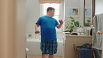 Man, dancing and fun with mirror in bathroom for concert, morning routine and grooming. Smile, dancer and cosmetics for brushing hair, musical performance and male person with down syndrome at house