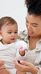Mom, baby and playing with toy for interaction, bonding or early childhood development in home. Happy mother, toddler or observation with smile or grip for reflexes, motor skills or hand coordination