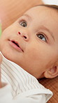 Calm, baby and boy rest on bed with thinking, relax and healthy for early childhood development. Comfortable, infant and innocent young child in home with wellness, wonder and curiosity for growth.