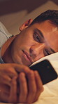 Night, man and scroll in bed with phone, fatigue and check social media for online entertainment. Late, exhausted person and typing in home with digital tech, mobile app or text message notification.