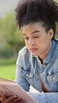 Woman, relax and reading book in park with peace, wellness or fantasy literature for calm weekend break. Person, rest or fiction novel outdoor with interesting story for knowledge, learning or hobby.