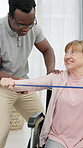 Physiotherapy, resistance band and elderly woman in wheelchair for mobility, stretching or exercise. Healthcare, physical therapist and person with disability for shoulder pain, strength and wellness