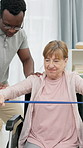Physiotherapy, wheelchair and elderly woman with resistance band for stretching, wellness or exercise. Healthcare, physical therapist and person with disability for shoulder pain, mobility and help