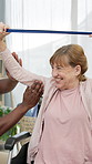 Physiotherapy, resistance band and senior person in wheelchair for mobility, wellness or healing. Healthcare, physical therapist and woman with disability stretching for service, recovery or exercise