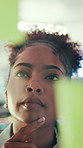 Black woman, thinking or brainstorming with glass wall for agenda, planning or project management. Sticky note, business person and creative review in office for strategy, problem solving or research