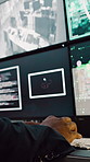 Computer screen, hands and typing with person in CCTV control room for satellite programming, Surveillance, live feed and coding with engineer at headquarters for security, support or mission update