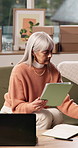 Woman, tablet and boxes at house for ecommerce logistics, inventory management and online order. Mature person, technology or checklist for stock check, quality assurance and information for shipping