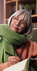 Home, thinking or senior woman with notebook for writing, mental health practice or gratitude journal. Idea, introspection or old person with diary for daily appreciation entry, mindfulness or smile